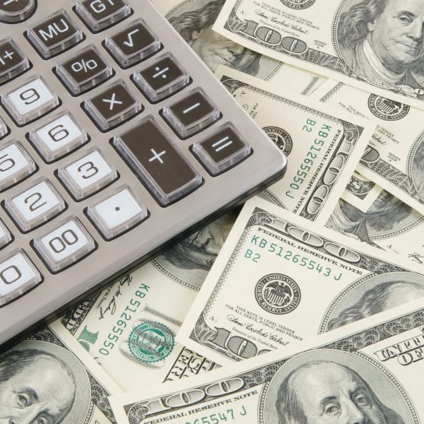 Business concept, calculator on money background